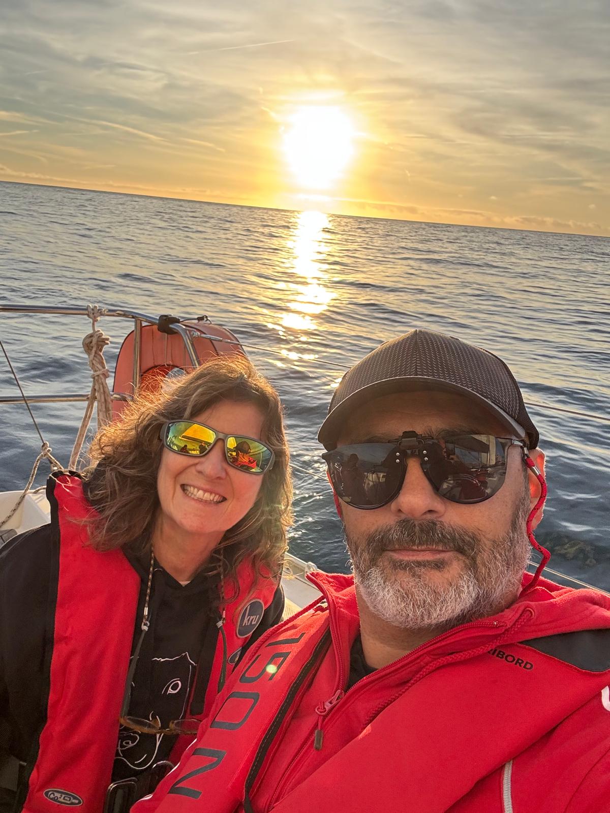 Couple enjoying a private sunset sail off the coast of Cascais